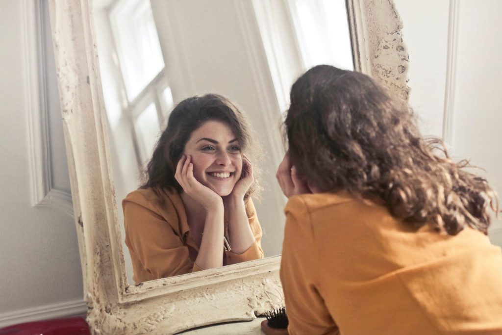 photo of woman looking at the mirror 774866 scaled 1